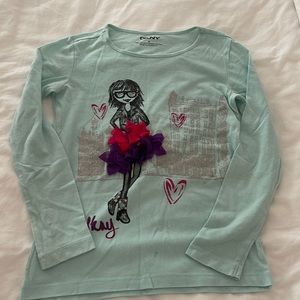 girls long sleeve tee with ruffled mesh material in the front